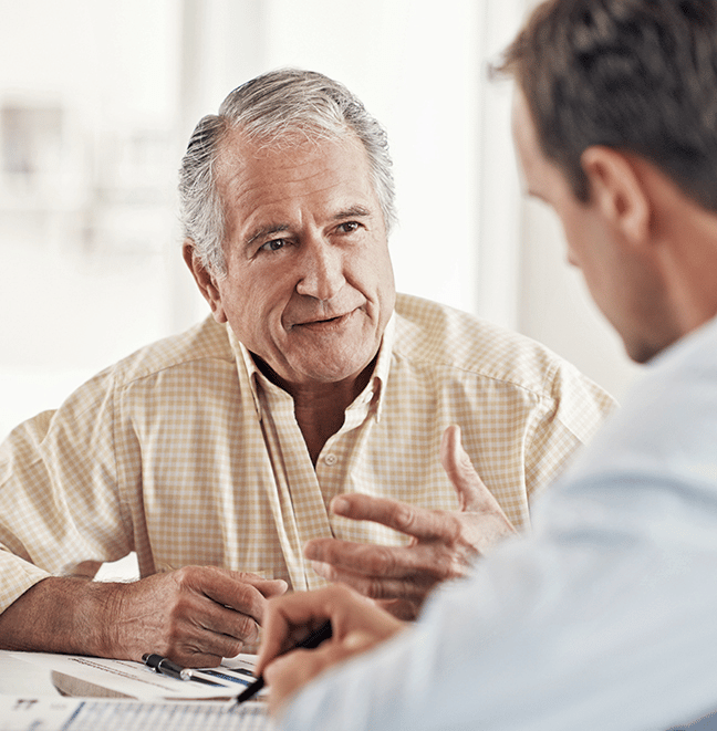 A retired man learning about life settlements from Lighthouse Life