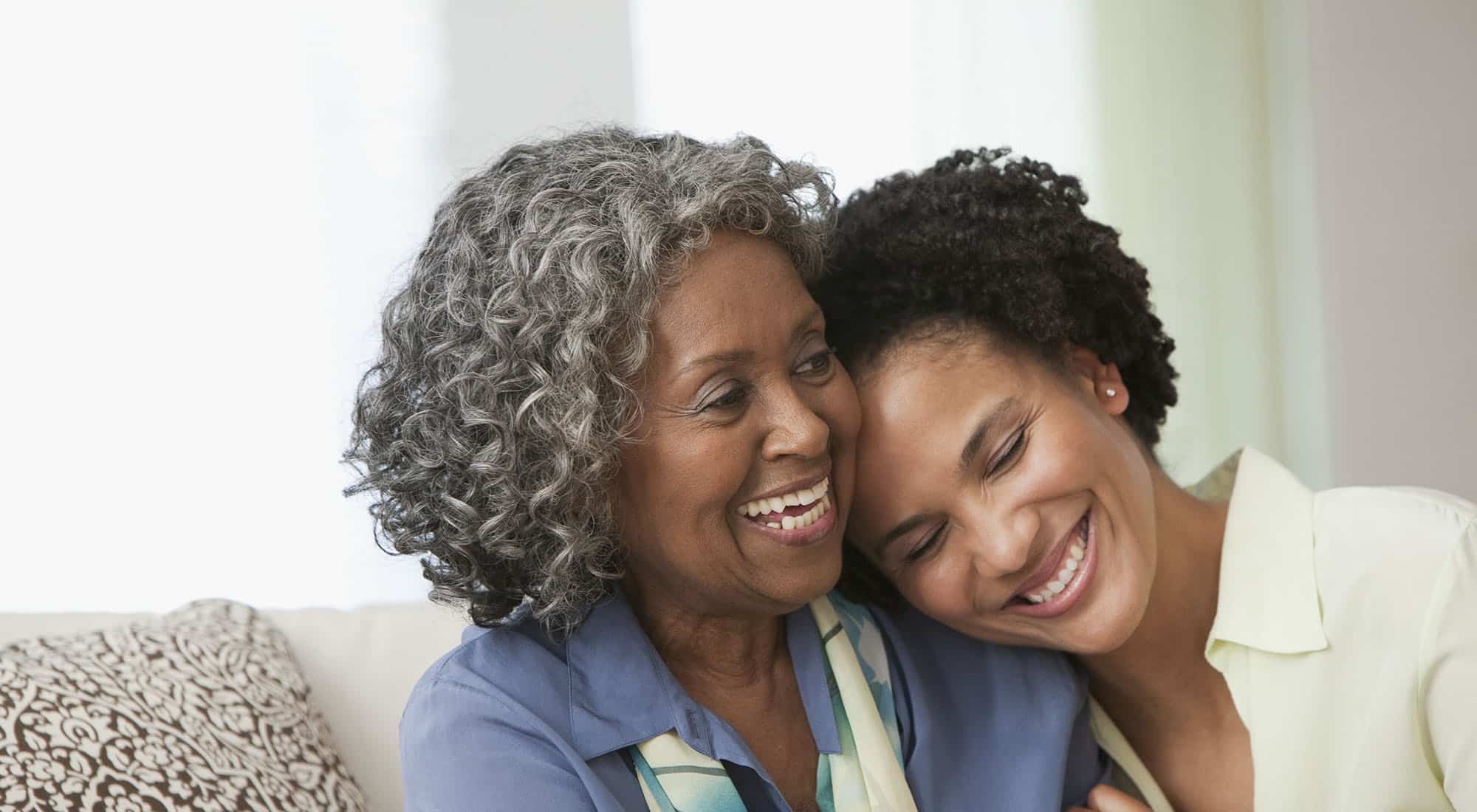 A retired woman and her daughter talking about retirement planning options