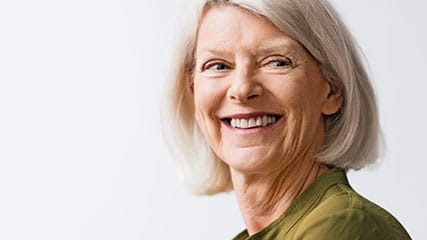 A senior woman smiling