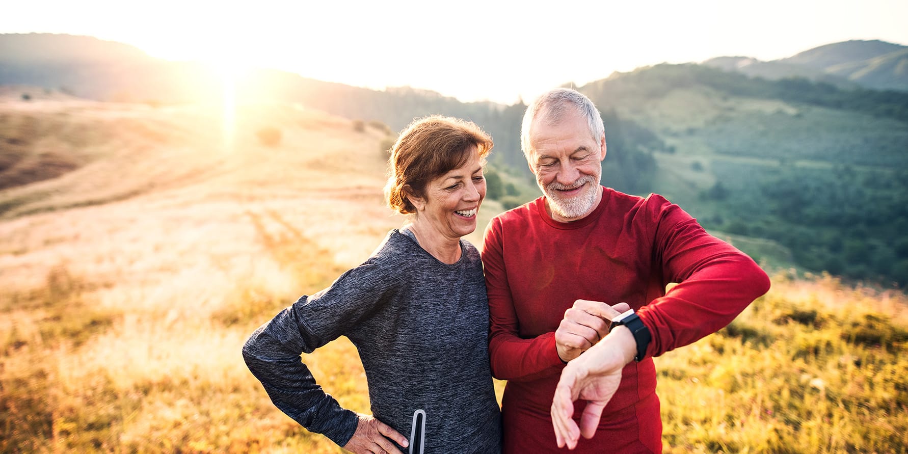 A couple who is enjoying a vacation after selling their term life insurance policy