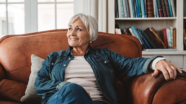 Recently divorced woman sitting in a leather chair