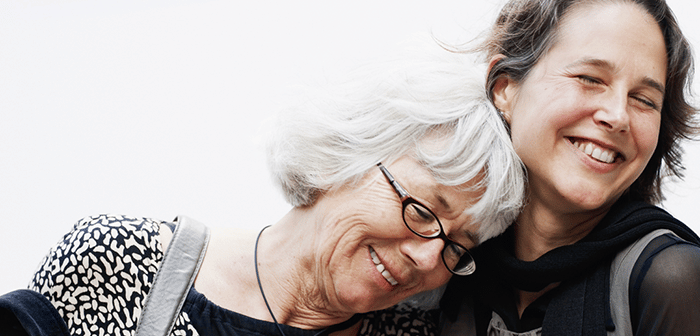 Mother and daughter hugging