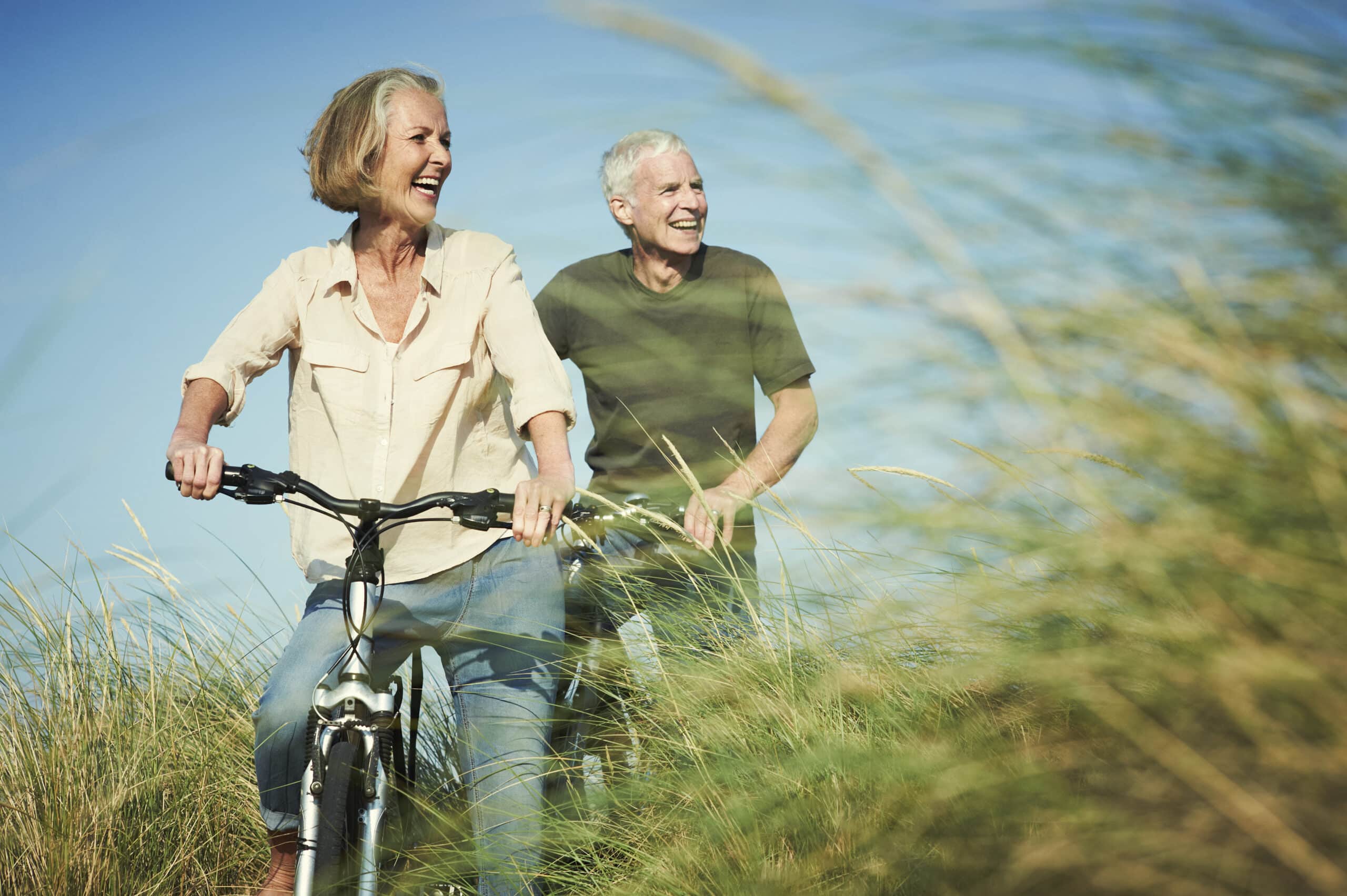 An active senior couple mountain biking
