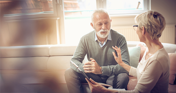 A financial advisor and client on a couch